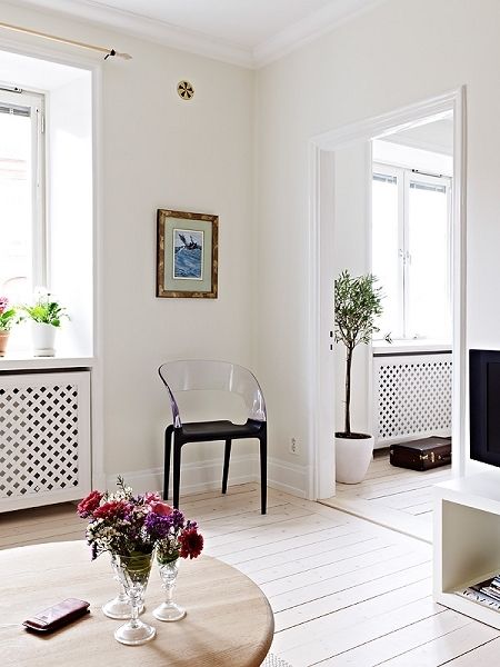 62平整洁北欧式公寓 浅色地板搭配纯白居室 